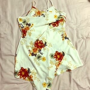Floral romper with asymmetric overlay